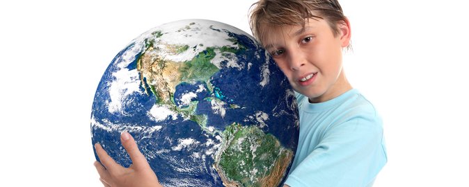 Boy with globe. Photo: Colourbox