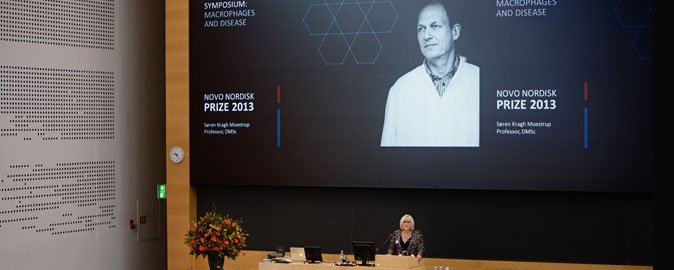 Director for the Novo Nordisk Foundation Birgitte Nauntofte welcomes participants to the Novo Nordisk Prize Symposium 2013. Photo: Martin Gravgaard Fotografi.