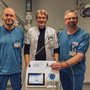 Specialty Registrar Kaare Meier (left), Professor, Department Chair Jens Christian H. Sørensen and Specialty Registrar Mikkel Mylius Rasmussen (right) with the device used for cryoneurolysis treatment. Photo: Lise Fitting.