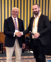 Professor and president of the CINP Siegfried Kasper from the Medical University of Vienna presented the award to Fredrik Hieronymus at The International College of Neuropsychopharmacology (CINP) annual conference, which was held in Athens this year. Photo: @Ryszarda Burmicz.